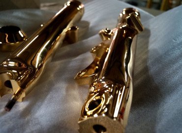 Polished Gold metal motorcycle forks