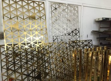 Pavonis Gold plated lasercut screens for commercial office fitout