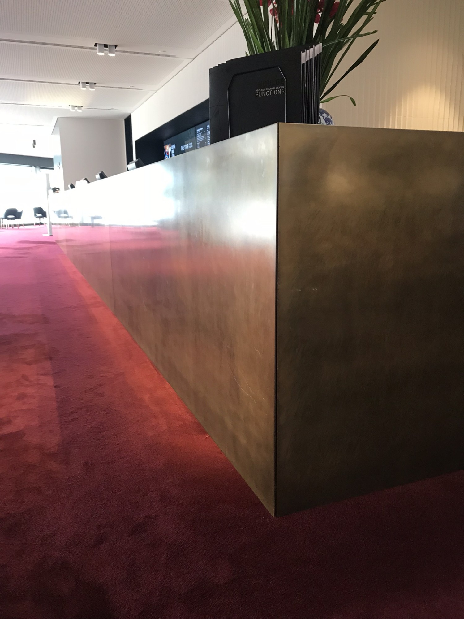 Light/ Medium patina to brass plated aluminium and stainless_sigange, reception, bins, framing, oeprable walls