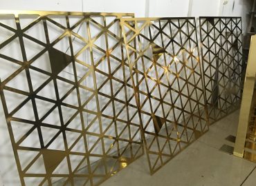Pavonis Gold plated metal lasercut screens for commercial office fitout