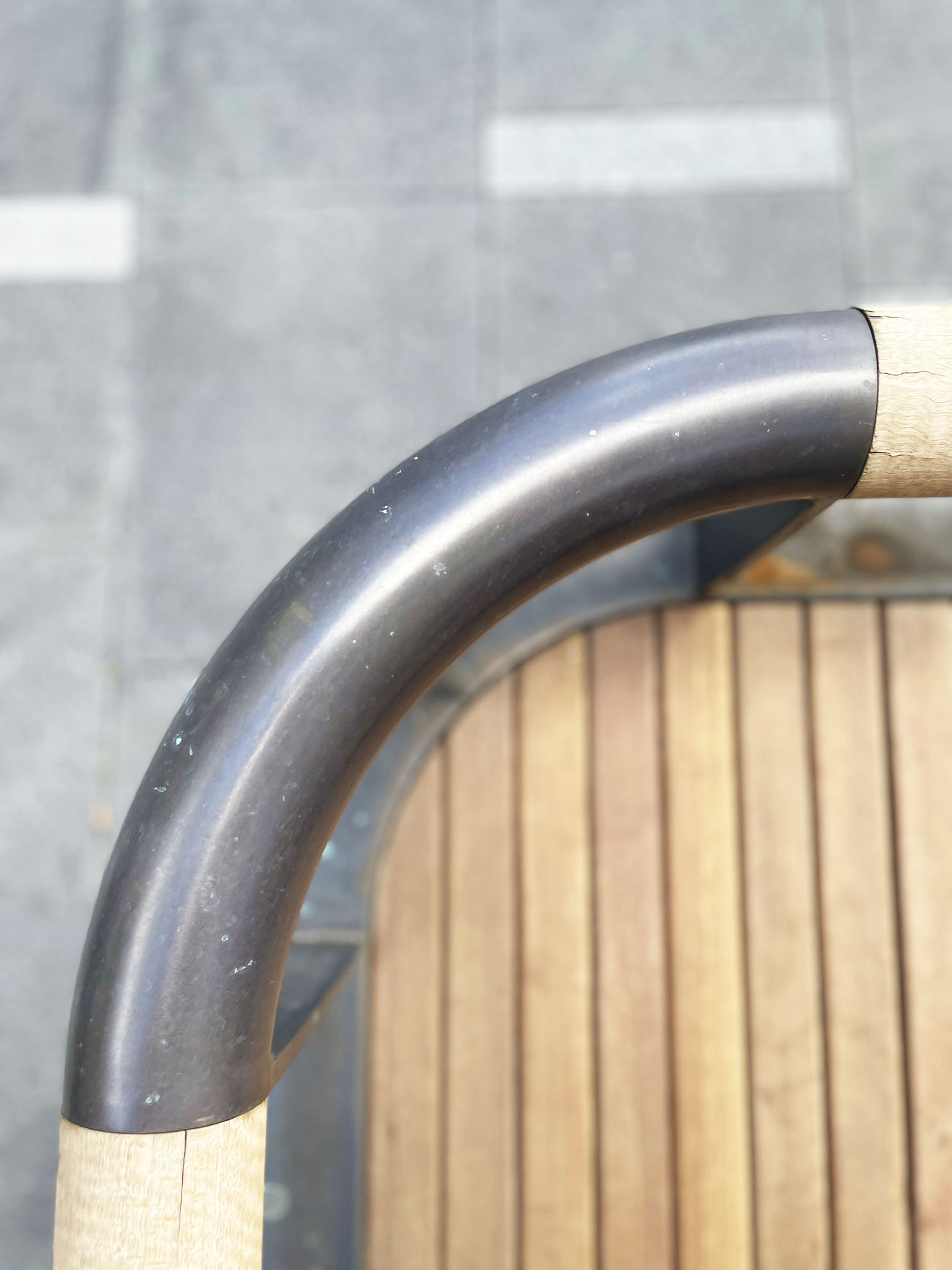 Dark Brown Bronze OIled to 80mm dia stainless tube (street furniture)