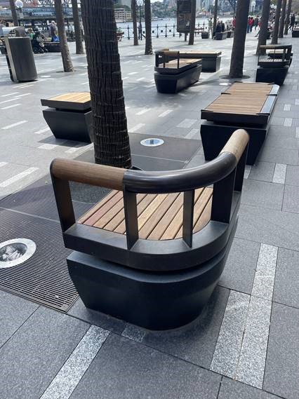 OIled dark bronze to stainless street furniture