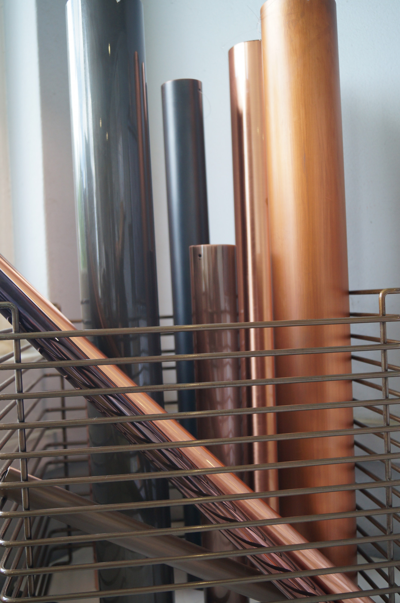 COpper plated aluminium tubes sitting in a Verner Panton Wire Cube 